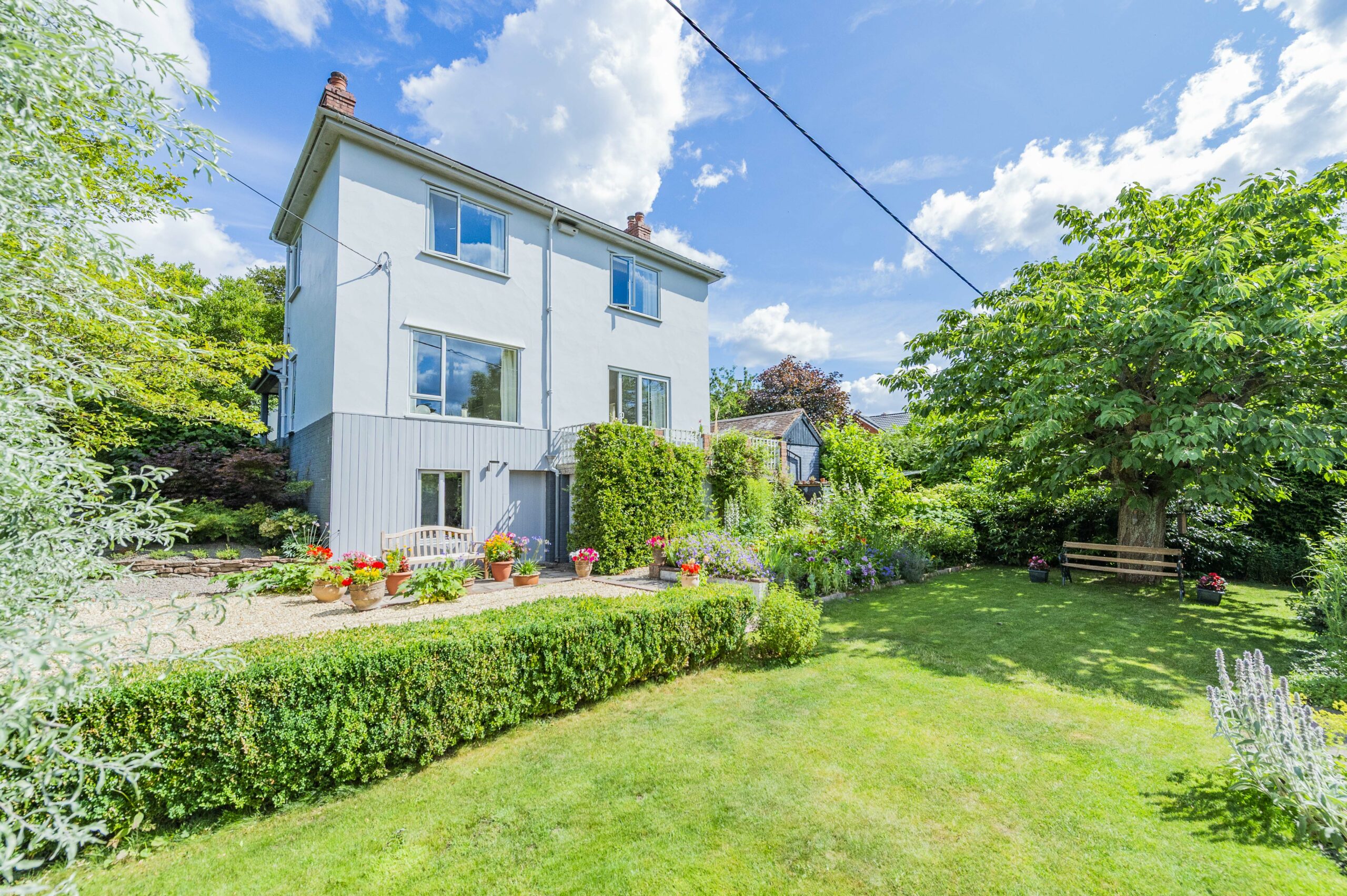 Home in vibrant village with generous plot
